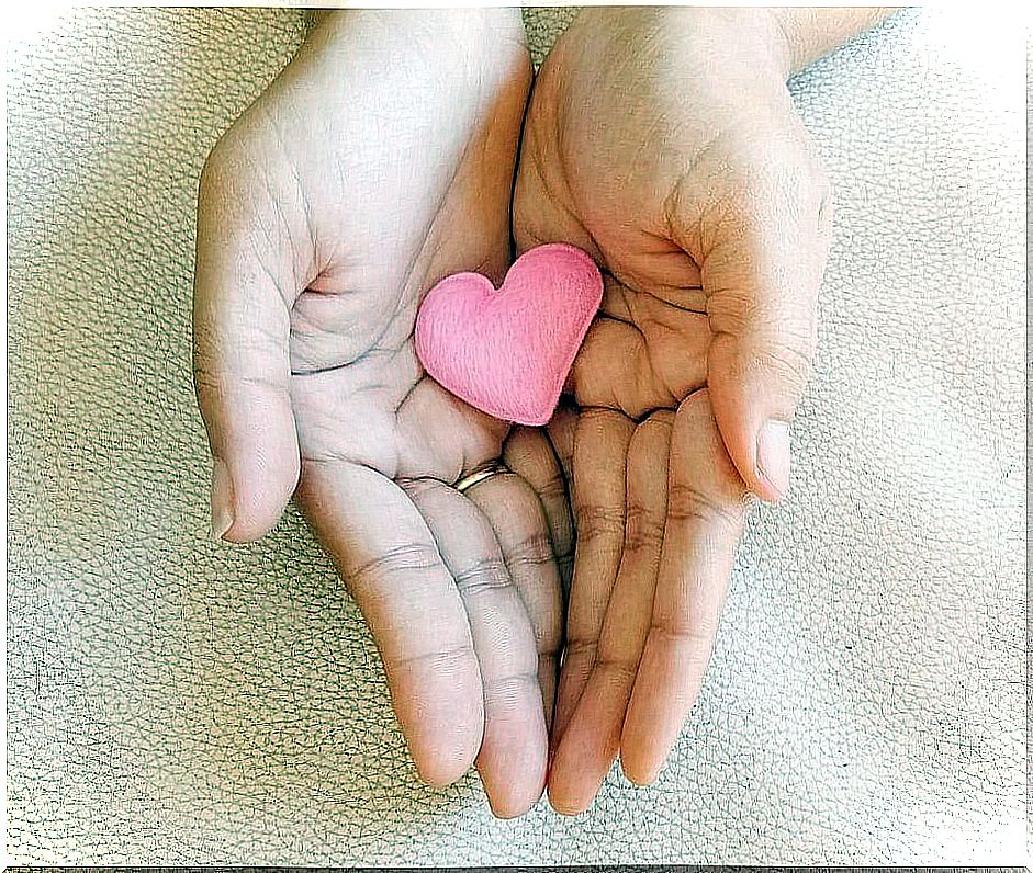 Hands holding a felt heart