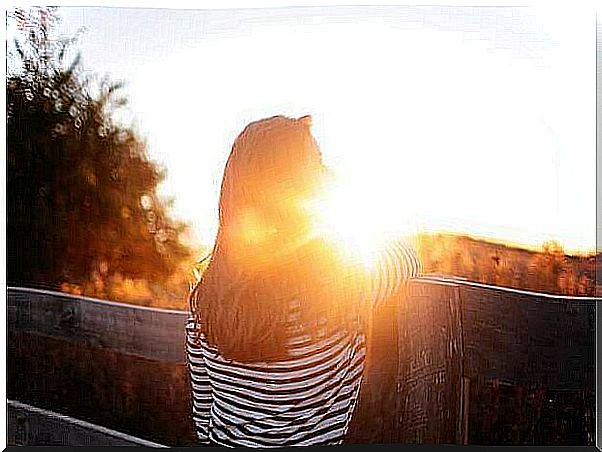 Woman watching the sunset