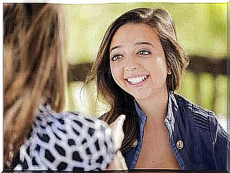 Two women in conversation.