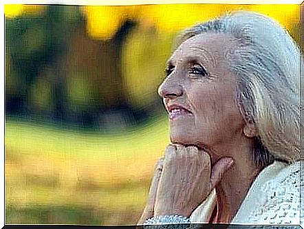 An elderly lady who looks peaceful.