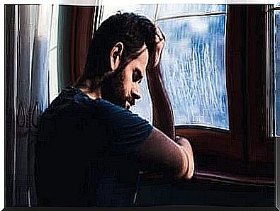 Sad man at the window