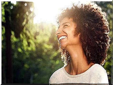 A smiling woman free from generalized anxiety disorder.