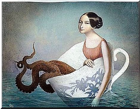 Woman with squid legs in a cup at sea