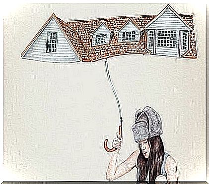 a woman holding an umbrella shaped like a roof