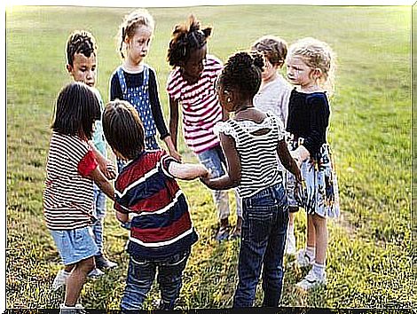 Children hold hands in a circle