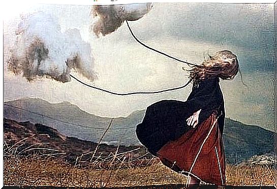 Girl pulls clouds in a thread