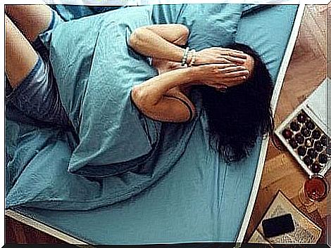 A woman in bed suffering from insomnia