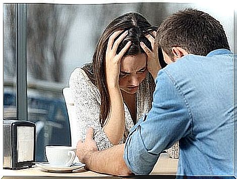 Couple arguing at cafe