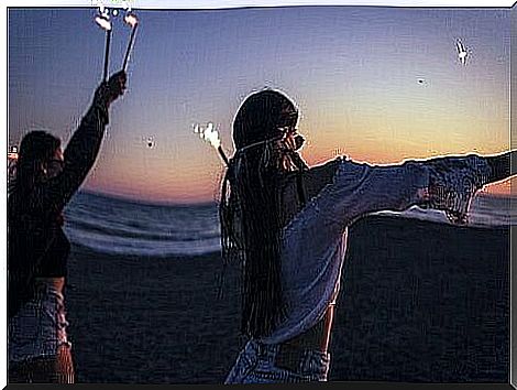 Teenagers have a party on the beach