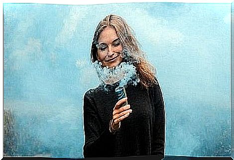 Woman smiling, surrounded by smoke